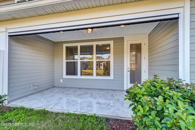 a view of a lake with houses in the background