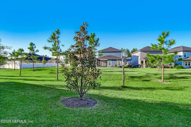a view of a chairs and table in patio