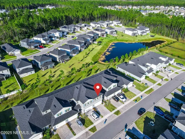 a view of a park with iron fence