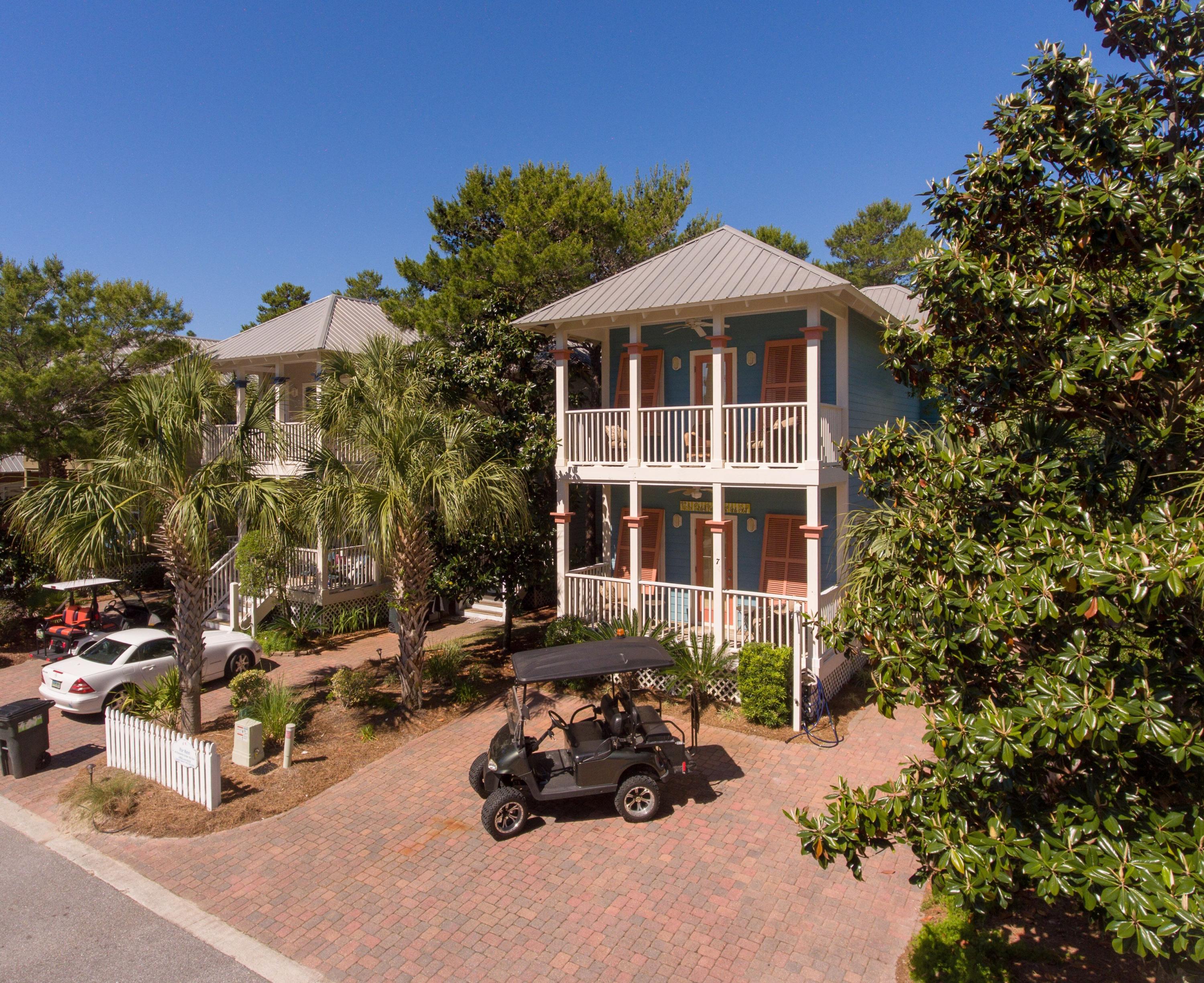 474 Hidden Lake Way Santa Rosa Beach, FL 32459 - Photo 1 of 34 a front view of a house with a garden