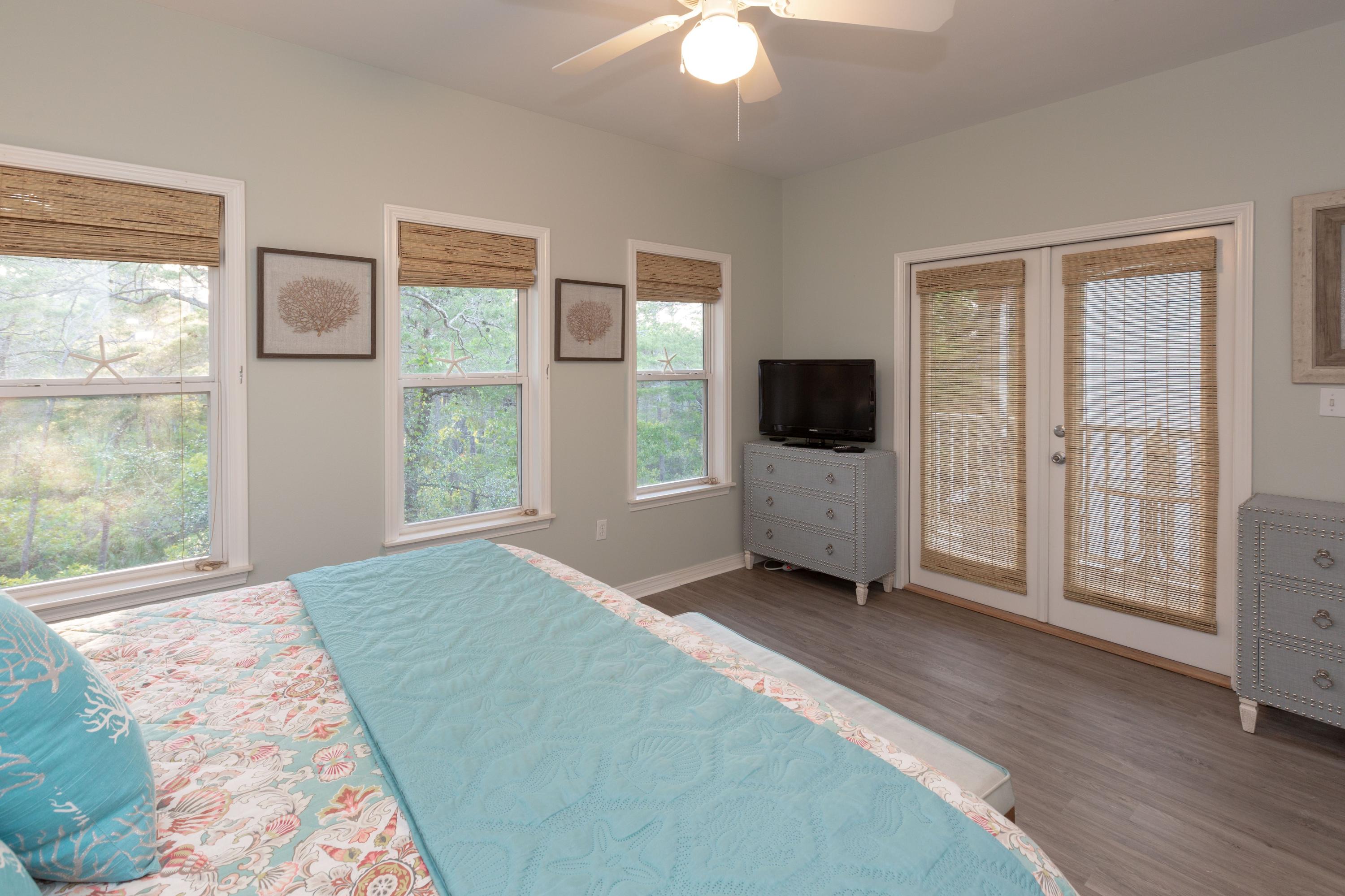 474 Hidden Lake Way Santa Rosa Beach, FL 32459 - Photo 15 of 34 a view of a bedroom with window and flat screen tv