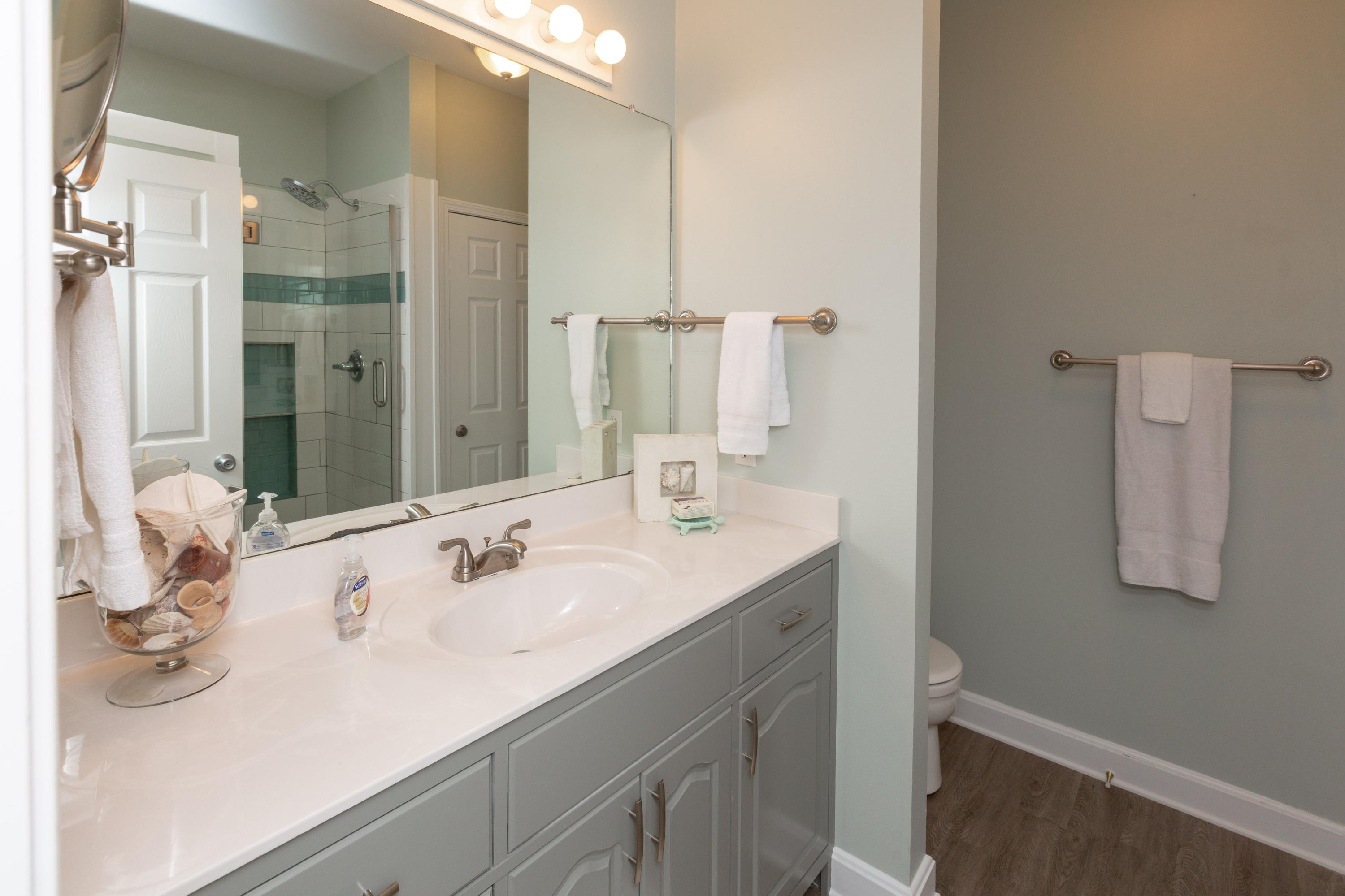 474 Hidden Lake Way Santa Rosa Beach, FL 32459 - Photo 17 of 34 a bathroom with a sink and a mirror