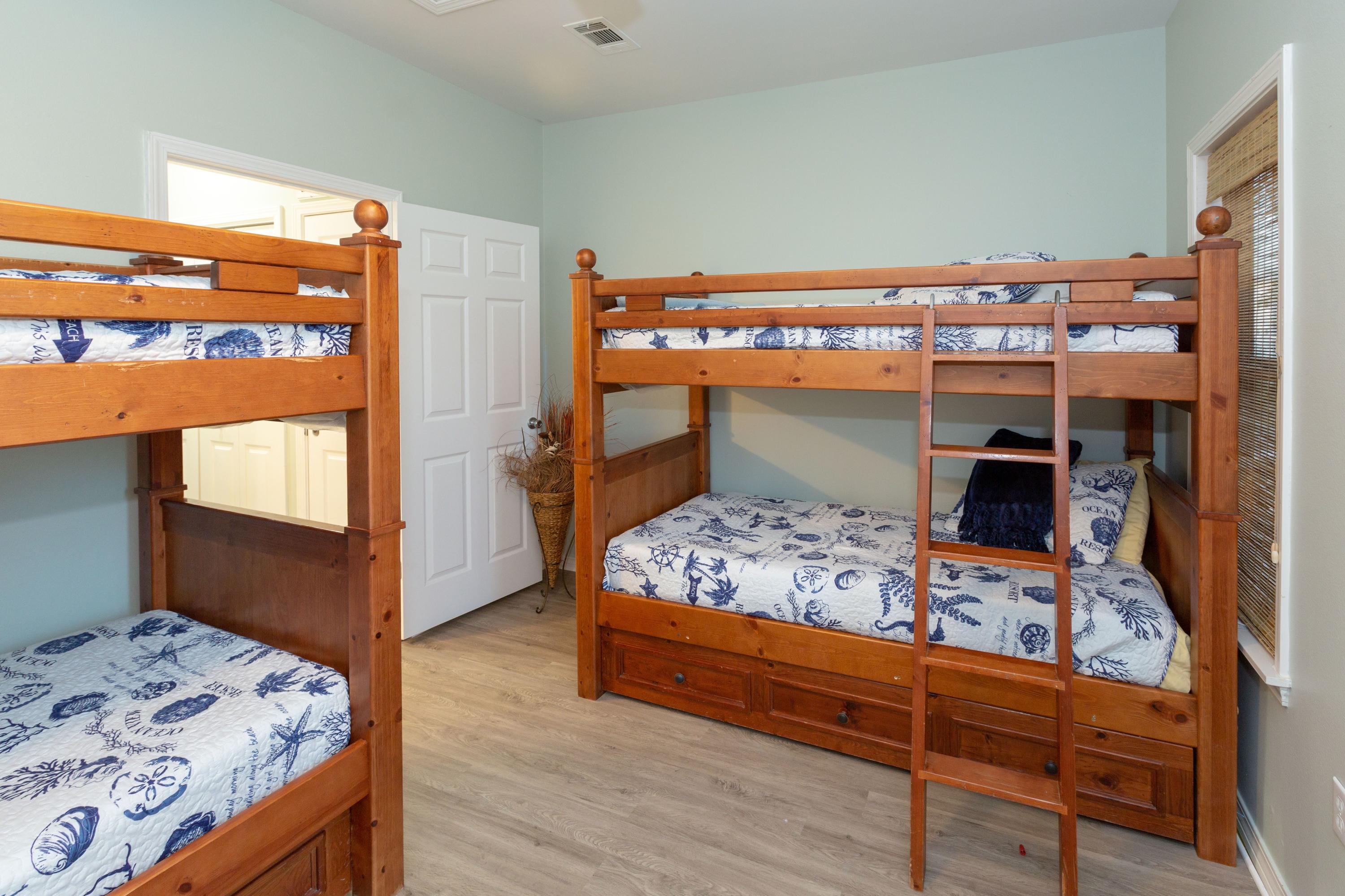 474 Hidden Lake Way Santa Rosa Beach, FL 32459 - Photo 18 of 34 a bedroom with a bed and a dresser in it