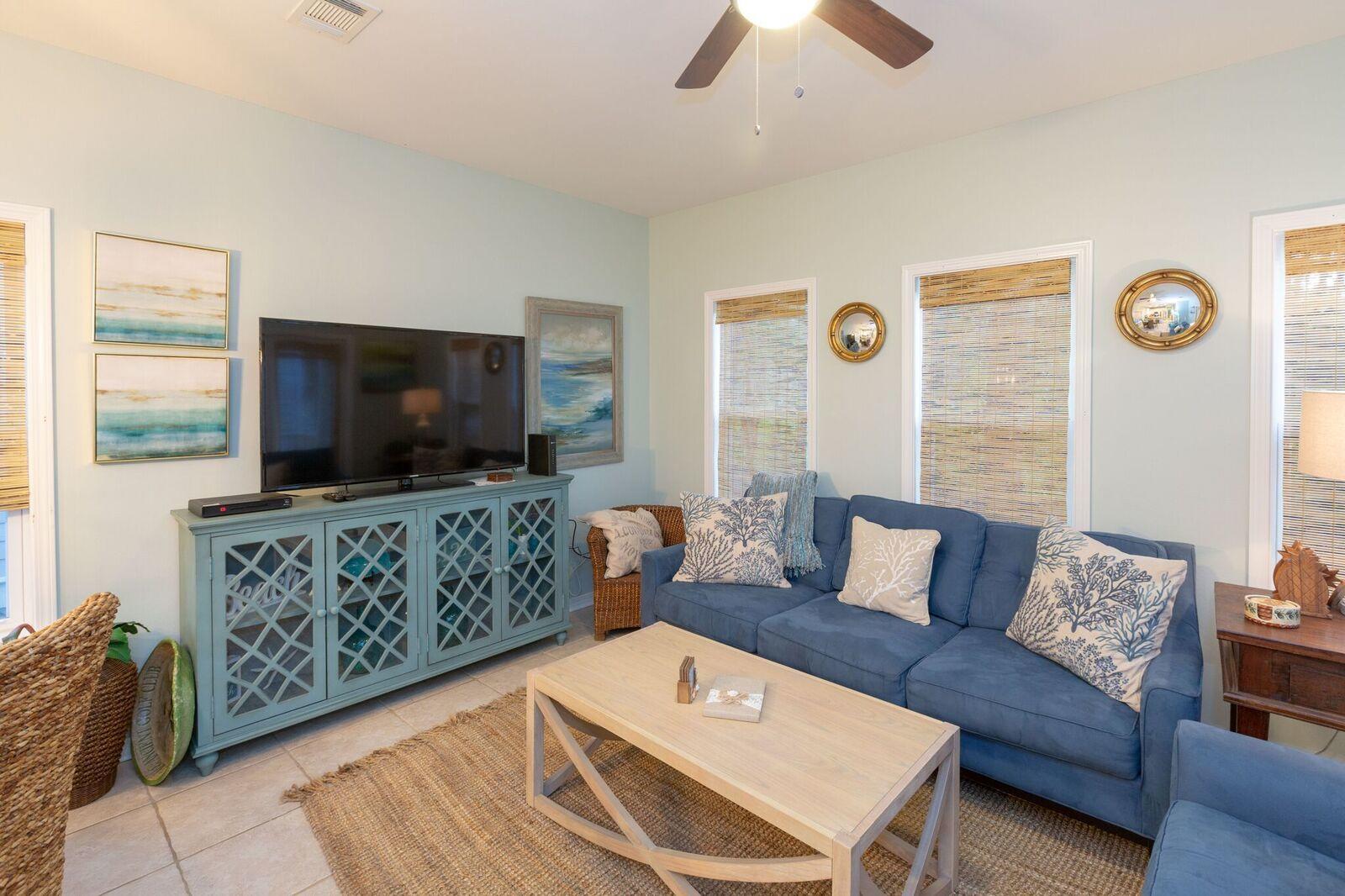 474 Hidden Lake Way Santa Rosa Beach, FL 32459 - Photo 3 of 34 a living room with furniture and a flat screen tv
