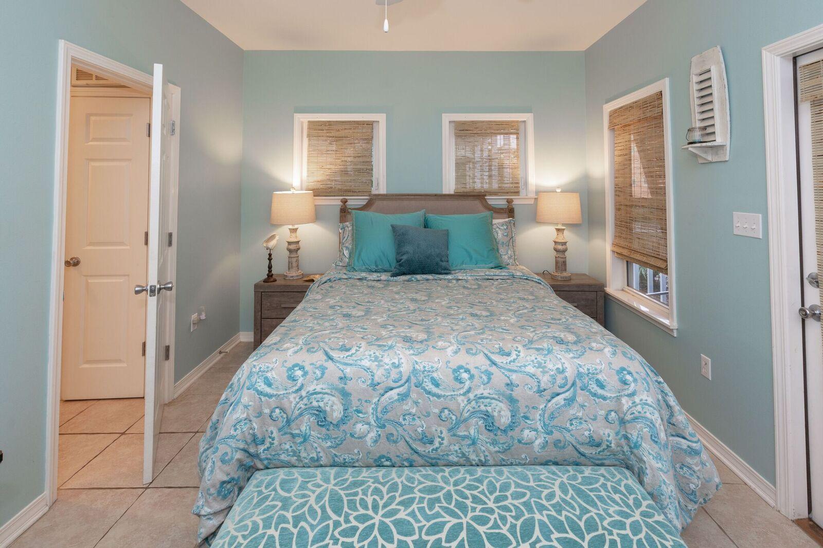 474 Hidden Lake Way Santa Rosa Beach, FL 32459 - Photo 9 of 34 a bedroom with a large bed and a chandelier