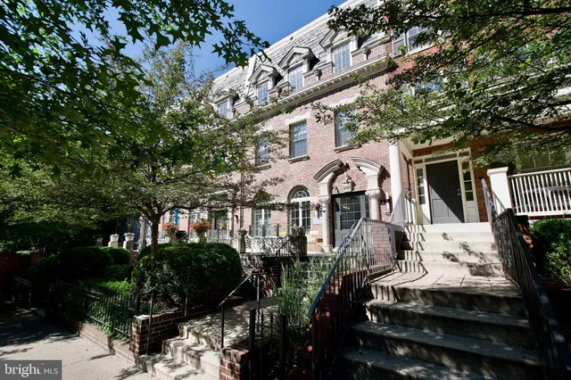 a front view of a house with yard