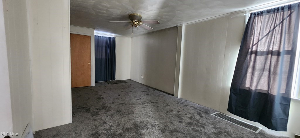 125 Rockdale Road Follansbee, WV 26037 - Photo 8 of 19 Spare room with carpet flooring and a ceiling fan