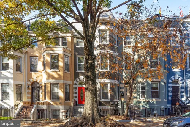 a front view of a building with a street