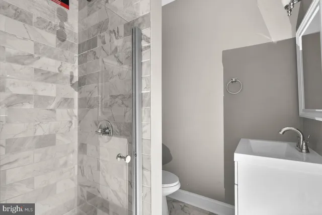 a bathroom with a sink and toilet