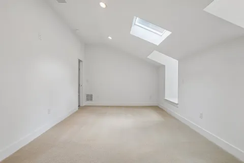 an empty room with a empty space and a window