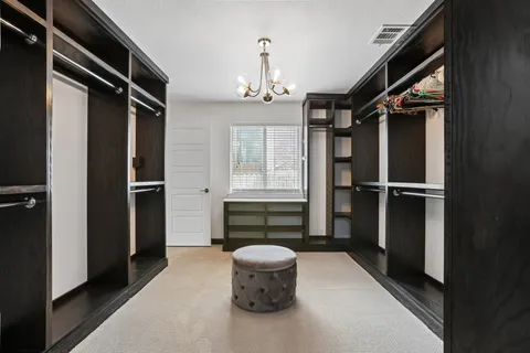 a hallway with furniture and window