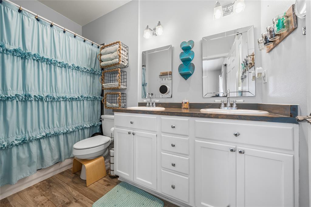 105 South 6th Street Celeste, TX 75423 - Photo 13 of 34 a bathroom with a sink toilet and shower