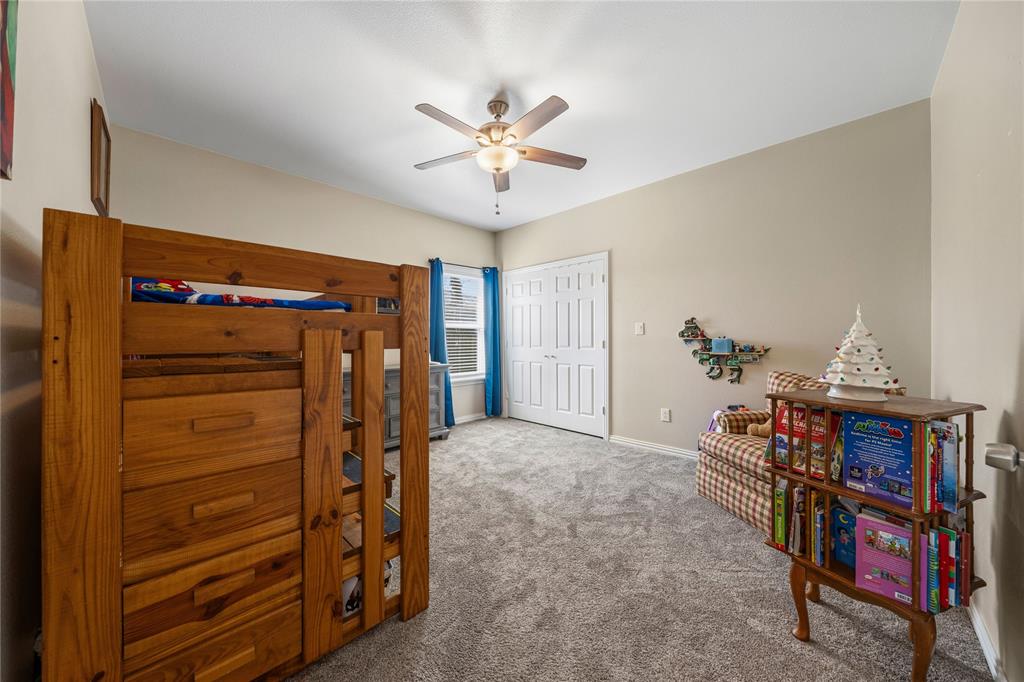 105 South 6th Street Celeste, TX 75423 - Photo 17 of 34 a view of walk in closet with a ceiling fan