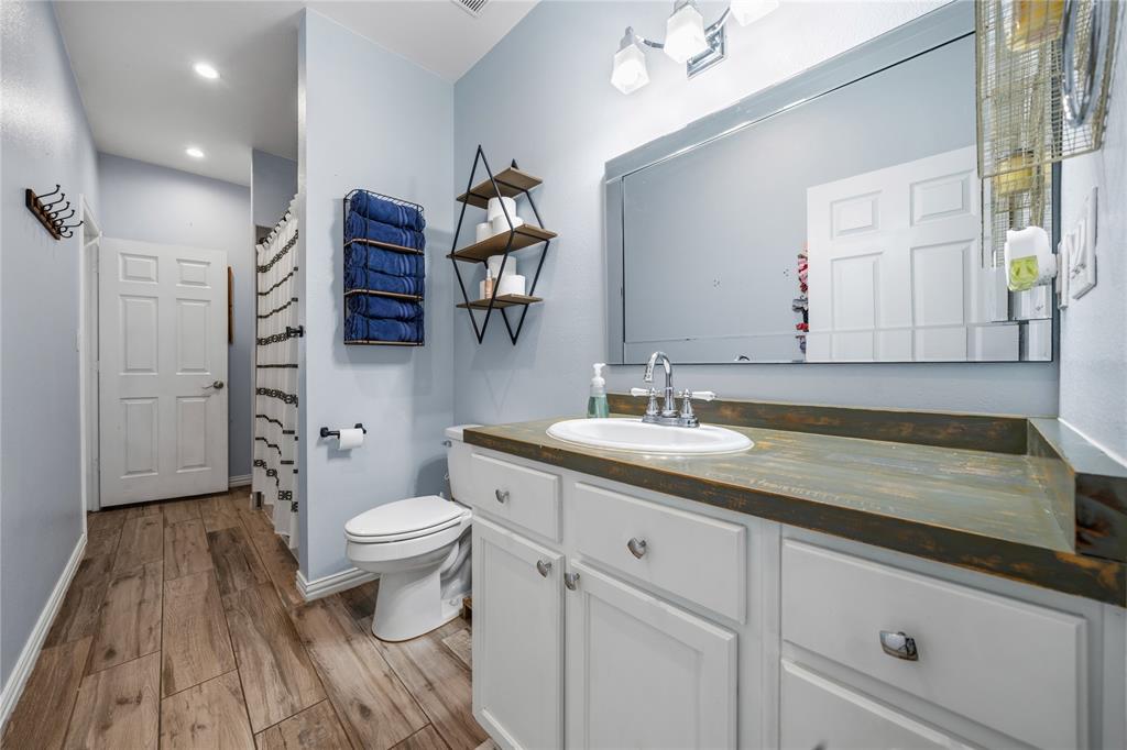105 South 6th Street Celeste, TX 75423 - Photo 19 of 34 a bathroom with a sink a toilet and shower