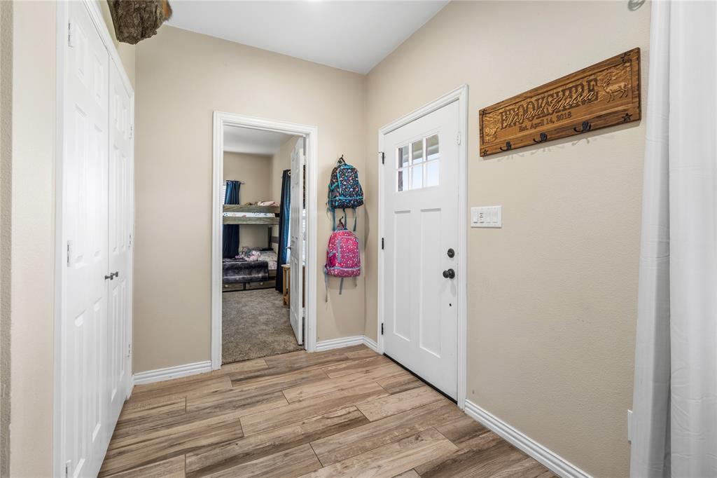 105 South 6th Street Celeste, TX 75423 - Photo 20 of 34 a view of a hallway with wooden floor and closet