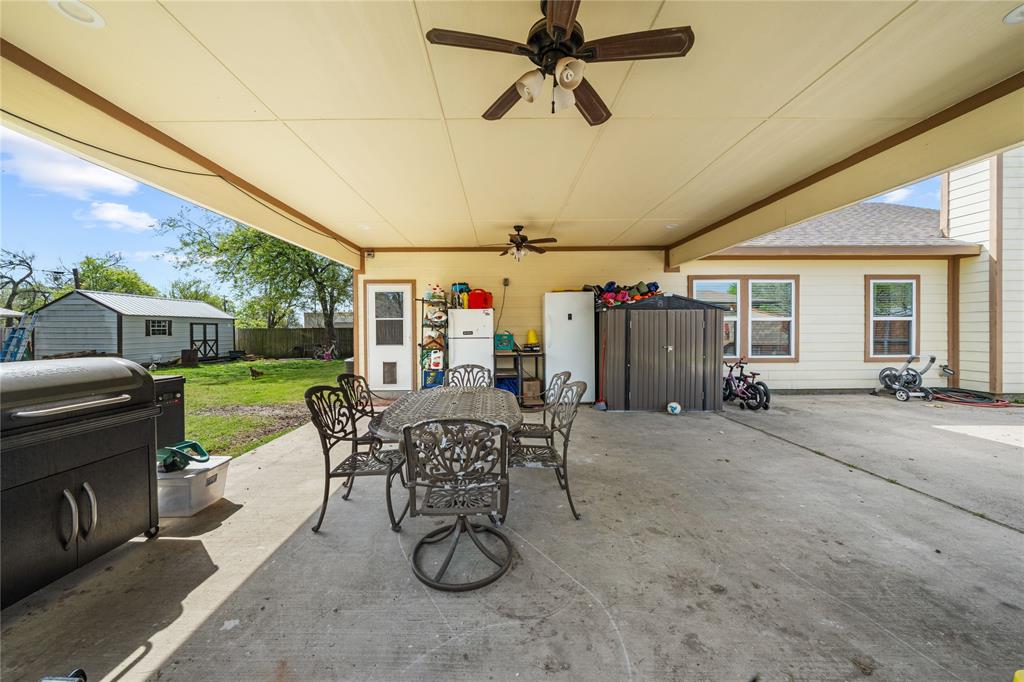 105 South 6th Street Celeste, TX 75423 - Photo 21 of 34 a view of a patio with a table and chairs