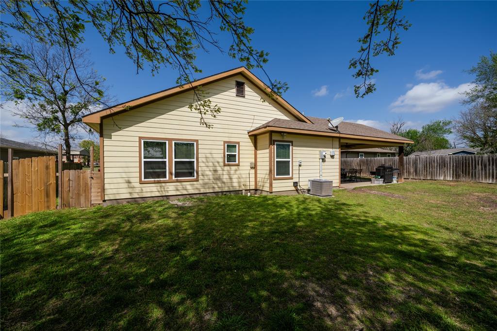 105 South 6th Street Celeste, TX 75423 - Photo 24 of 34 a front view of a house with a garden