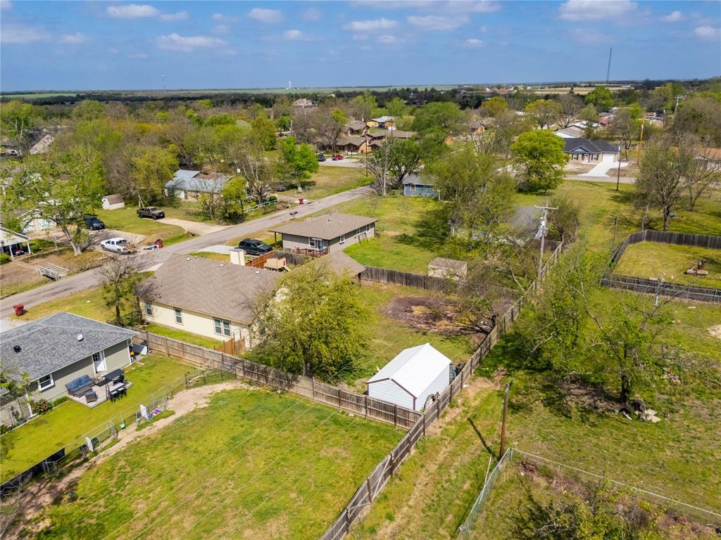 105 South 6th Street Celeste, TX 75423 - Photo 25 of 34 an aerial view of residential houses with outdoor space