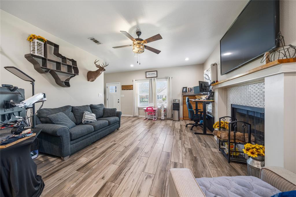 105 South 6th Street Celeste, TX 75423 - Photo 3 of 34 a living room with furniture and a wooden floor