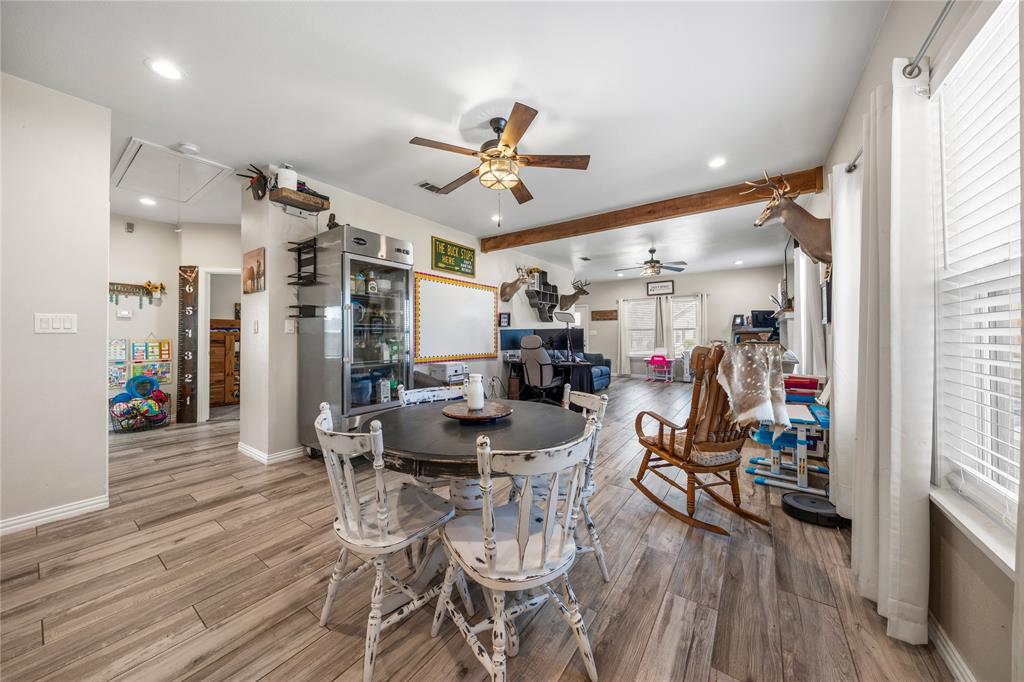 105 South 6th Street Celeste, TX 75423 - Photo 10 of 34 a view of a dining room with furniture window and wooden floor