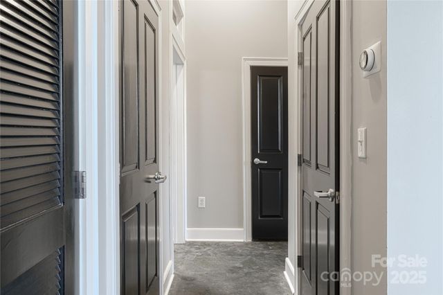 a view of a bathroom from a corridor