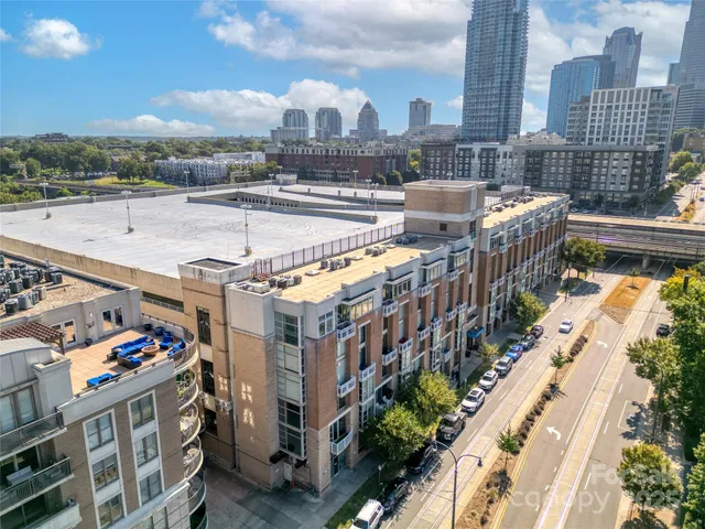 a view of city from balcony with outdoor seating
