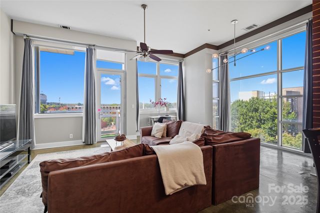 a living room with furniture and windows