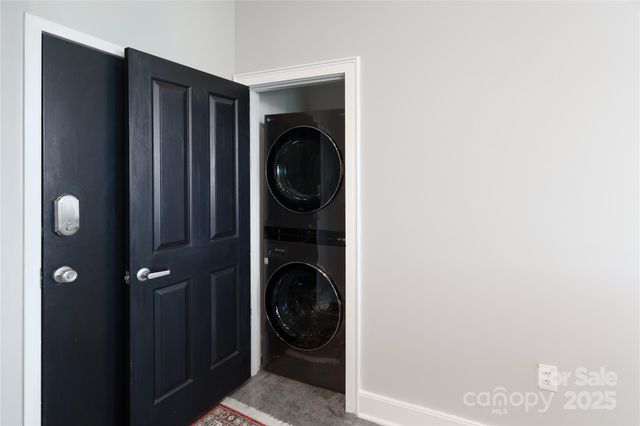 a close view of a utility room with washer and dryer