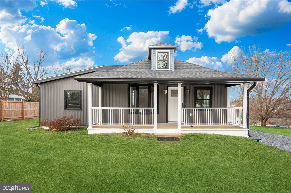 9932 Kelly Road Frederick, MD 21701 - Photo 1 of 74 a front view of a house with a garden