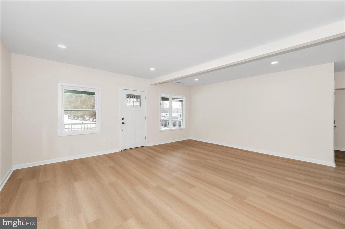 9932 Kelly Road Frederick, MD 21701 - Photo 14 of 74 a view of an empty room with wooden floor and a window
