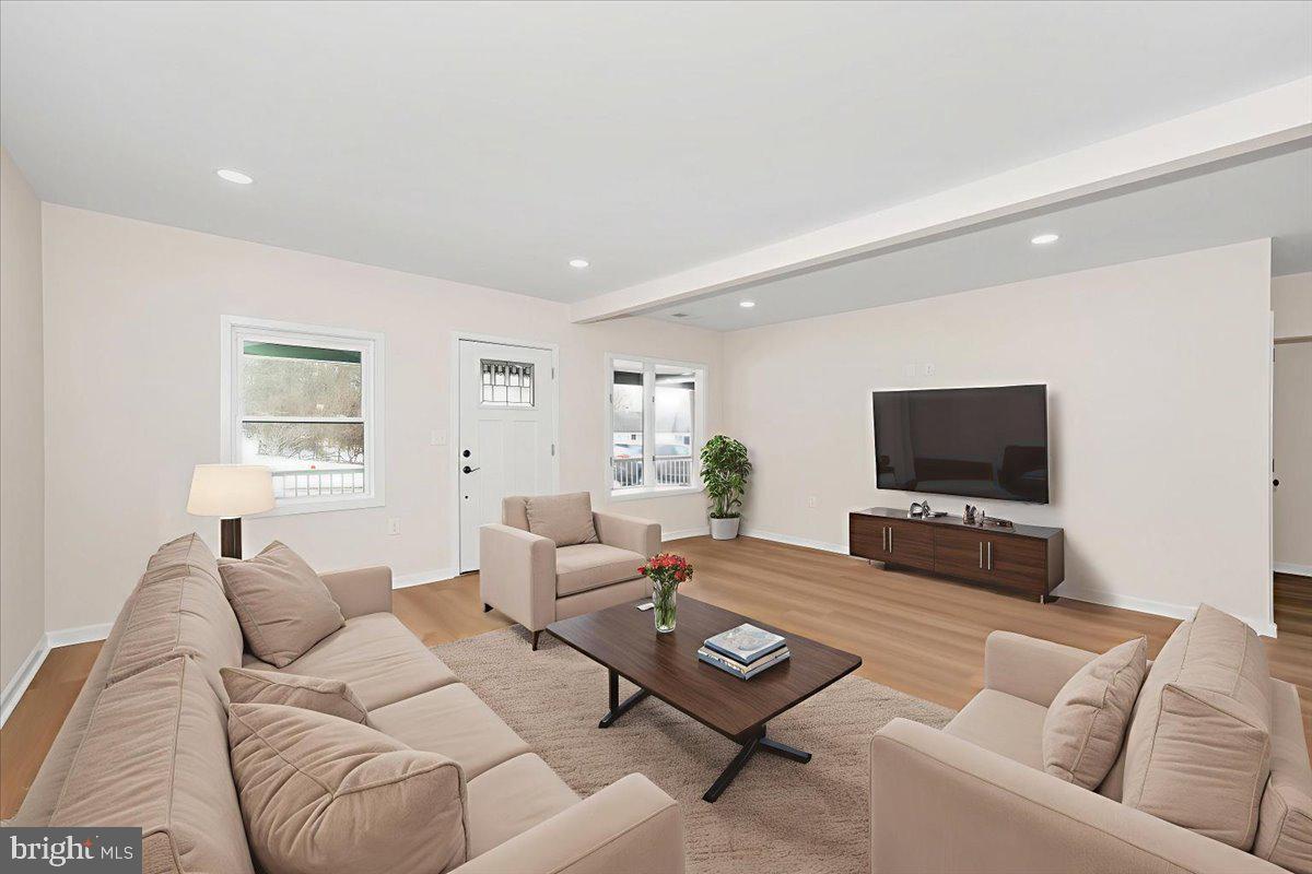 9932 Kelly Road Frederick, MD 21701 - Photo 15 of 74 a living room with furniture and a flat screen tv