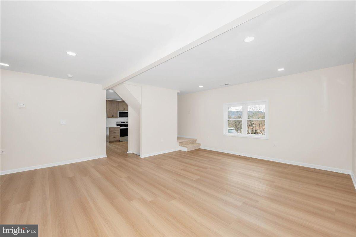 9932 Kelly Road Frederick, MD 21701 - Photo 19 of 74 wooden floor in an empty room with a window