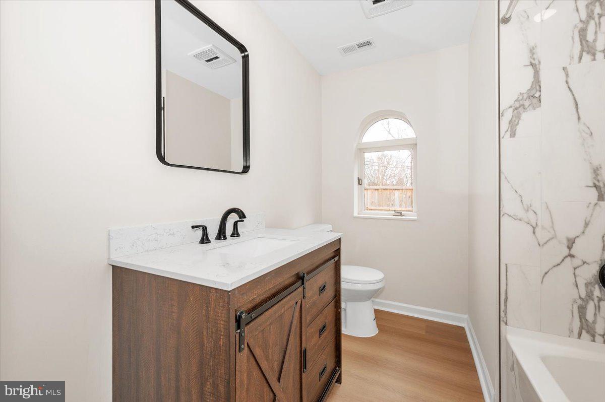 9932 Kelly Road Frederick, MD 21701 - Photo 33 of 74 a bathroom with a sink a toilet and a mirror