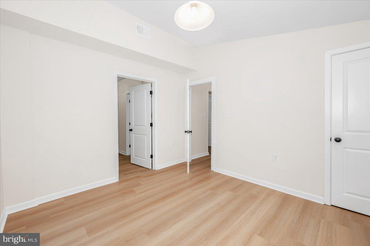 9932 Kelly Road Frederick, MD 21701 - Photo 40 of 74 an empty room with wooden floor