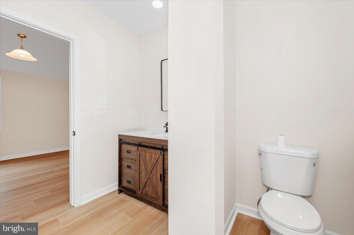 9932 Kelly Road Frederick, MD 21701 - Photo 42 of 74 a bathroom with a toilet a sink and mirror