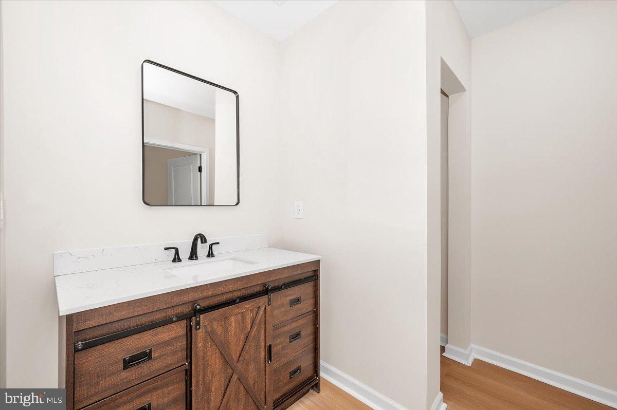 9932 Kelly Road Frederick, MD 21701 - Photo 45 of 74 a bathroom with a sink and a mirror