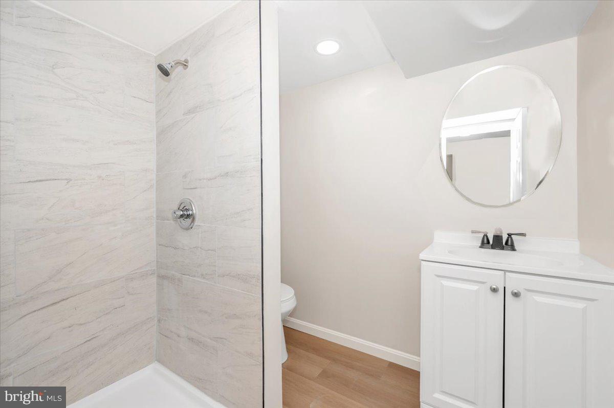 9932 Kelly Road Frederick, MD 21701 - Photo 55 of 74 a bathroom with a sink a mirror and vanity