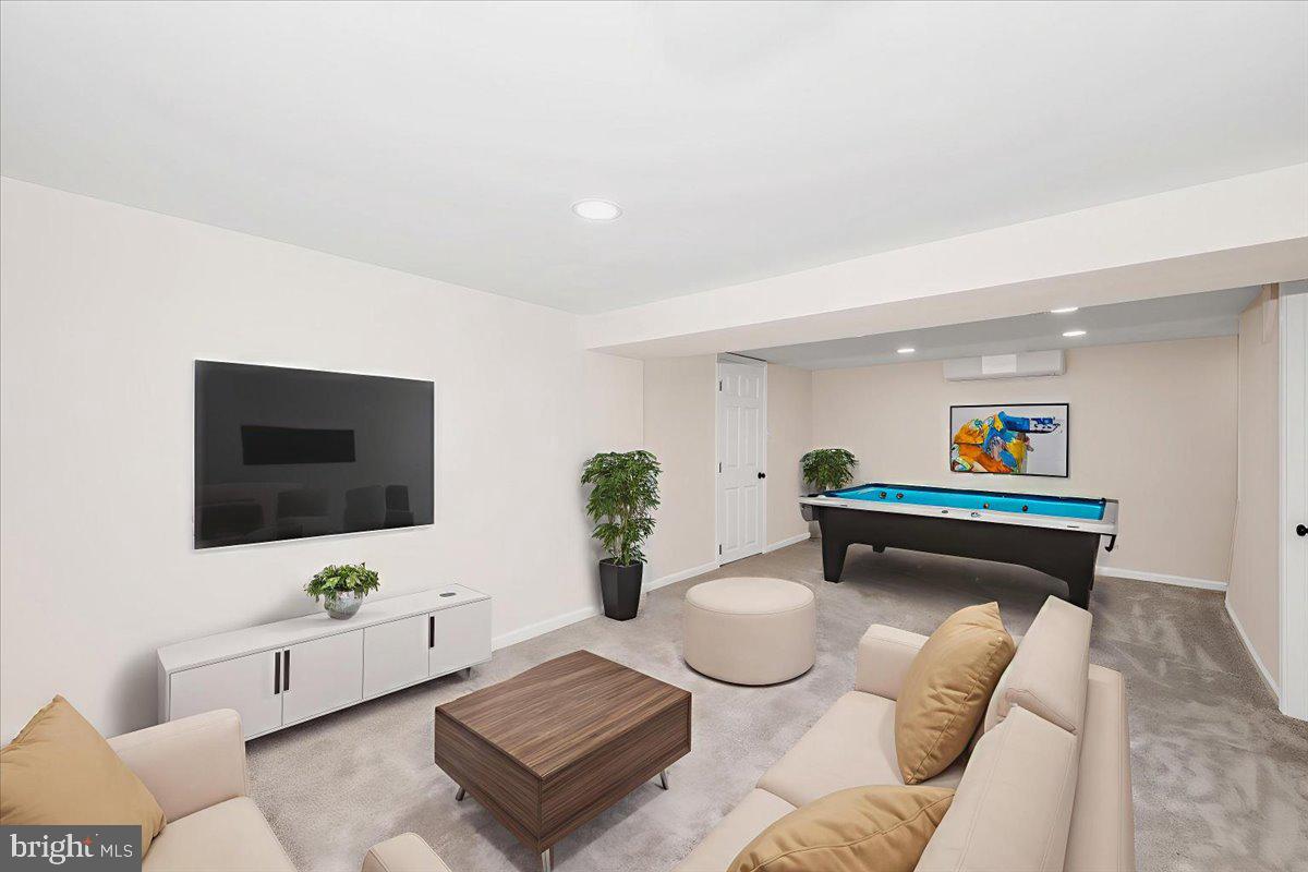 9932 Kelly Road Frederick, MD 21701 - Photo 58 of 74 a living room with furniture and a flat screen tv