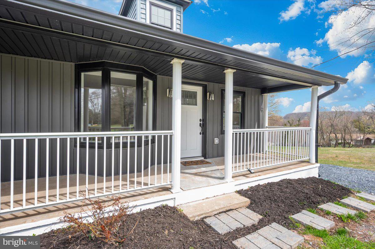 9932 Kelly Road Frederick, MD 21701 - Photo 73 of 74 a view of a house with a small yard and wooden floor and fence