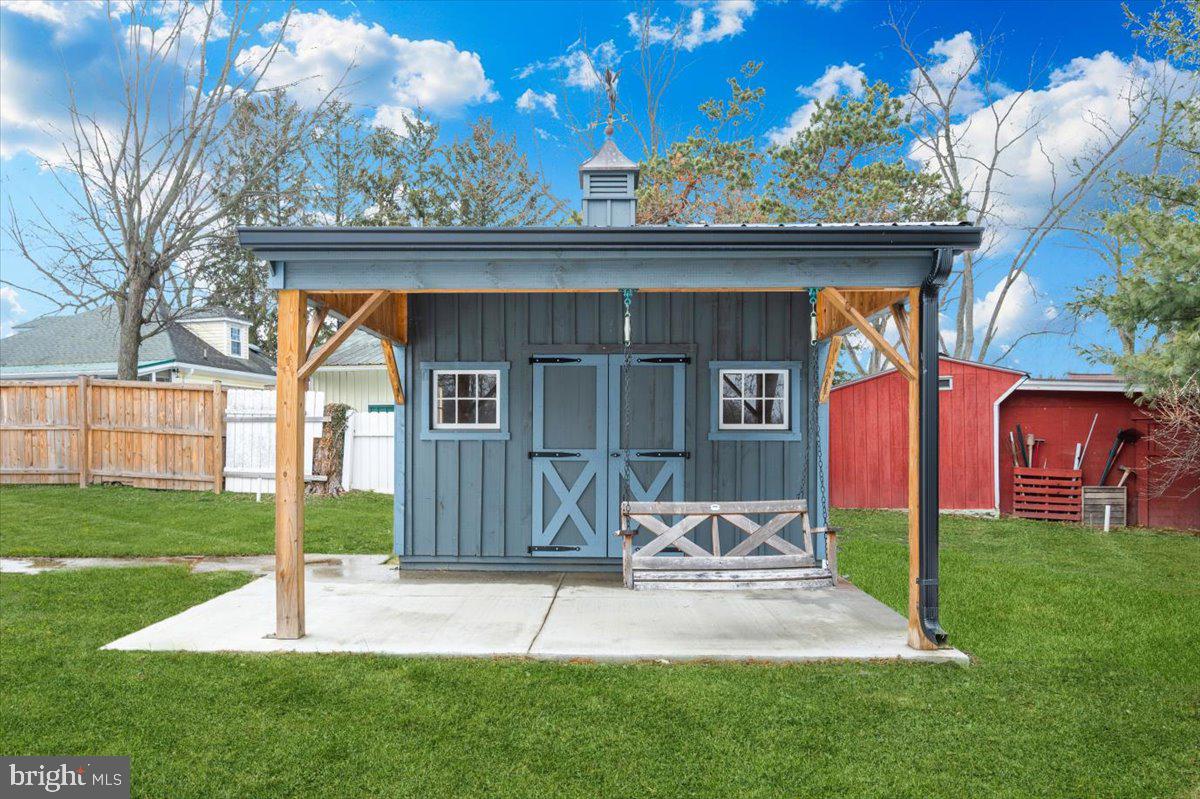 9932 Kelly Road Frederick, MD 21701 - Photo 9 of 74 a view of a chair and table in backyard of the house