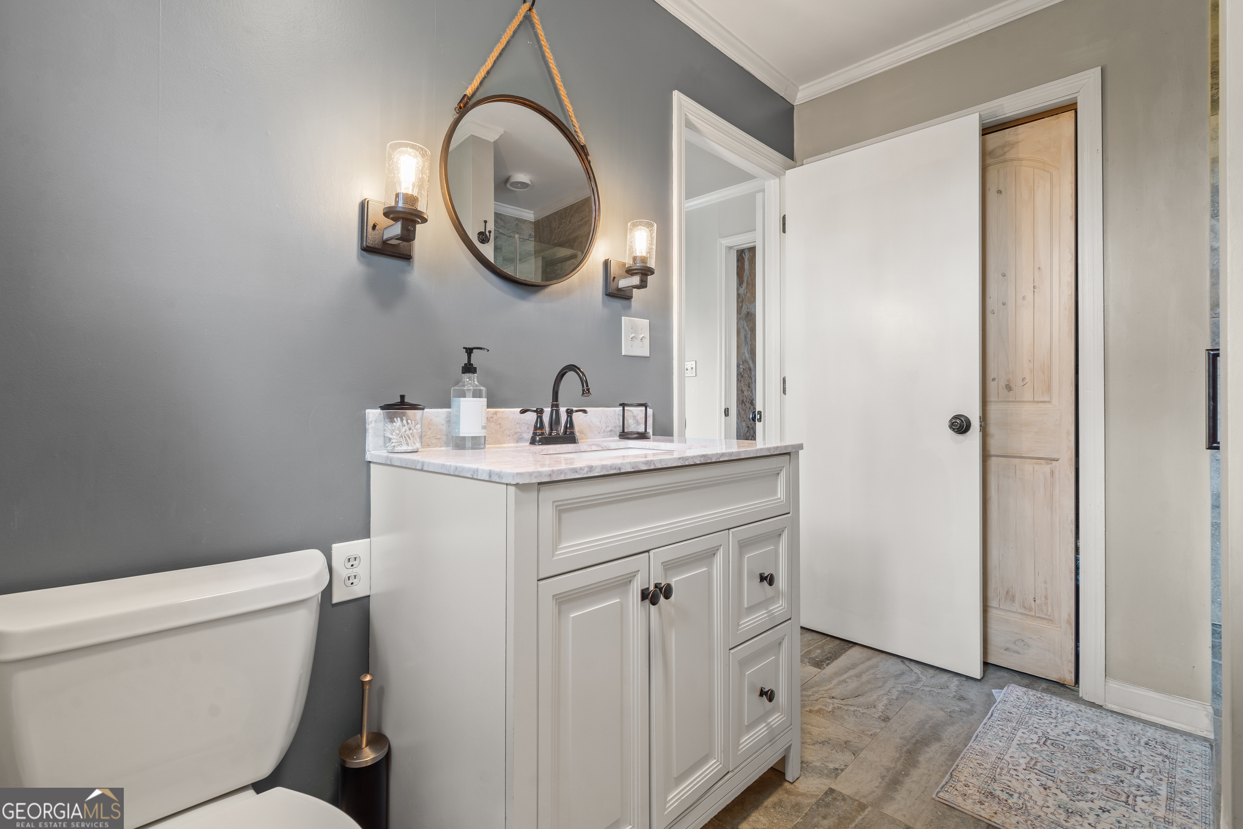 426 Crow Creek Road Lakemont, GA 30552 - Photo 24 of 60 a bathroom with a sink a toilet and a mirror