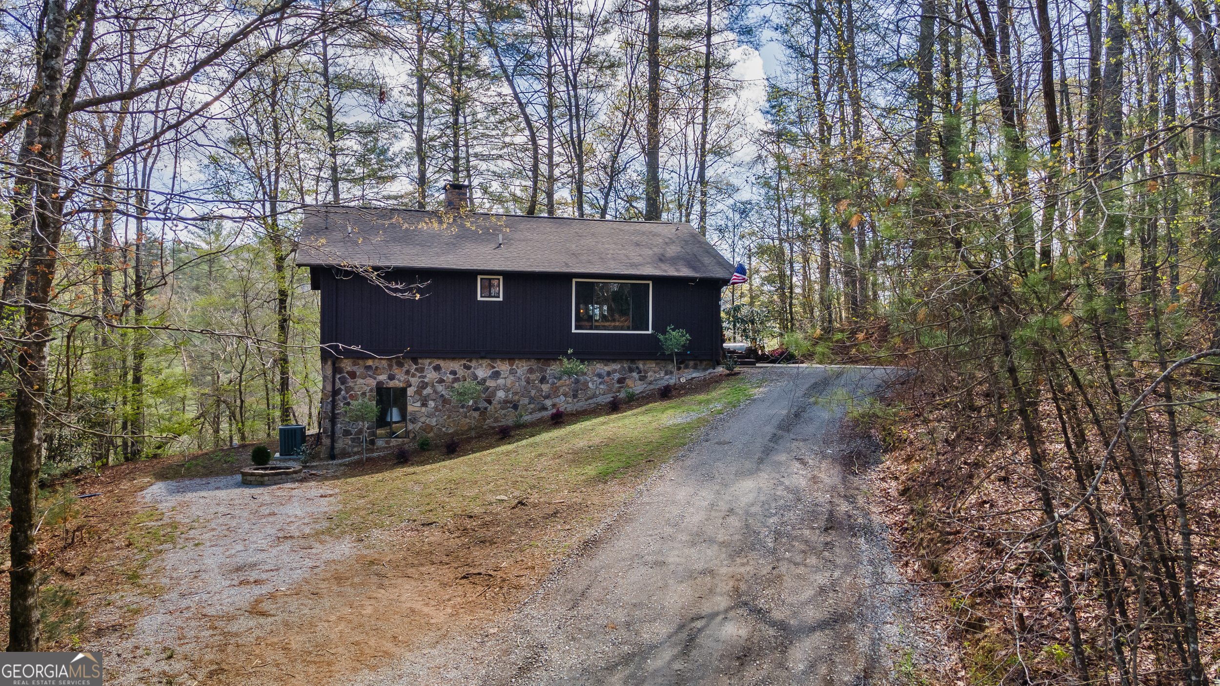 426 Crow Creek Road Lakemont, GA 30552 - Photo 7 of 60 a view of a house with large trees