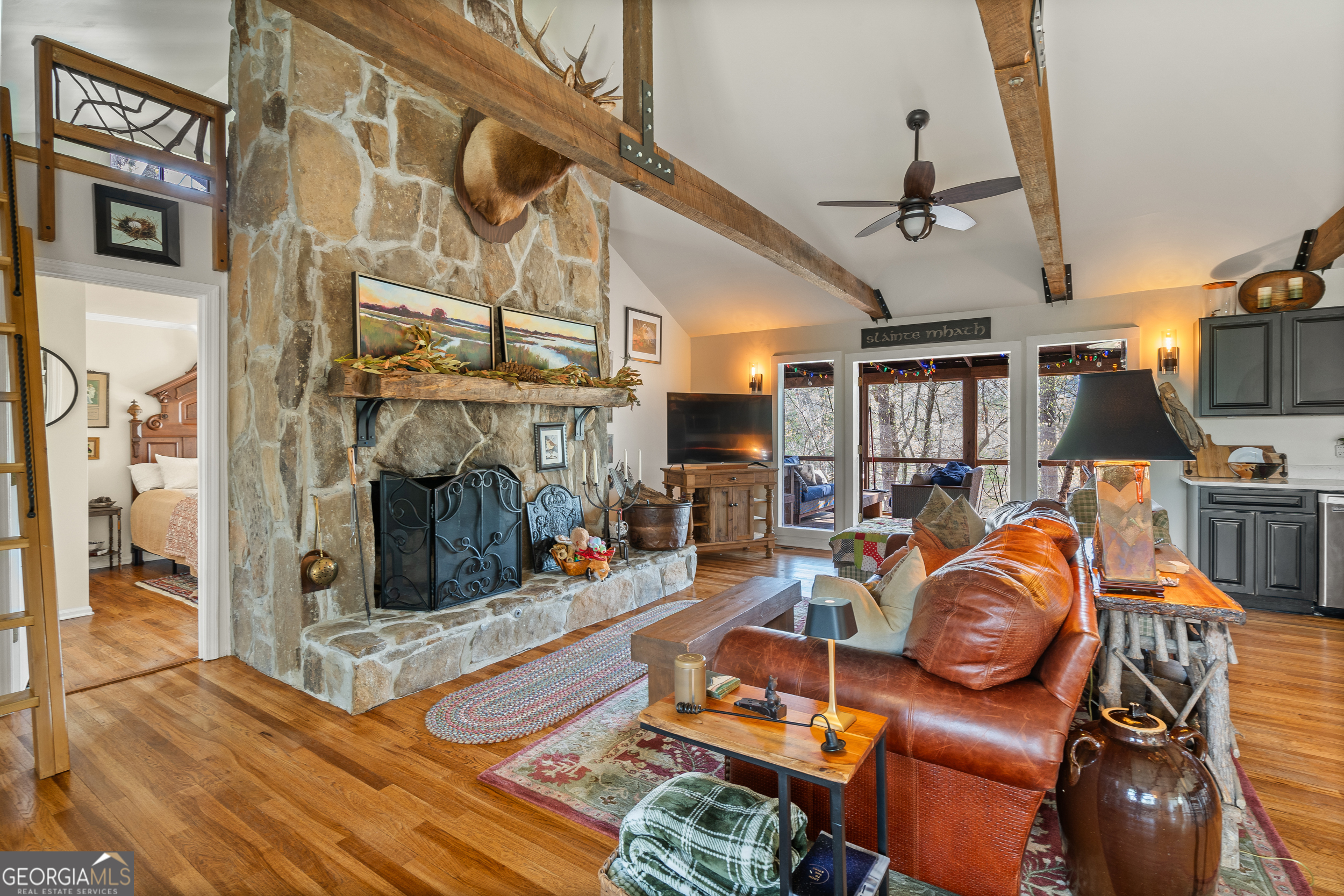 426 Crow Creek Road Lakemont, GA 30552 - Photo 10 of 60 a view of a livingroom with furniture and a fireplace