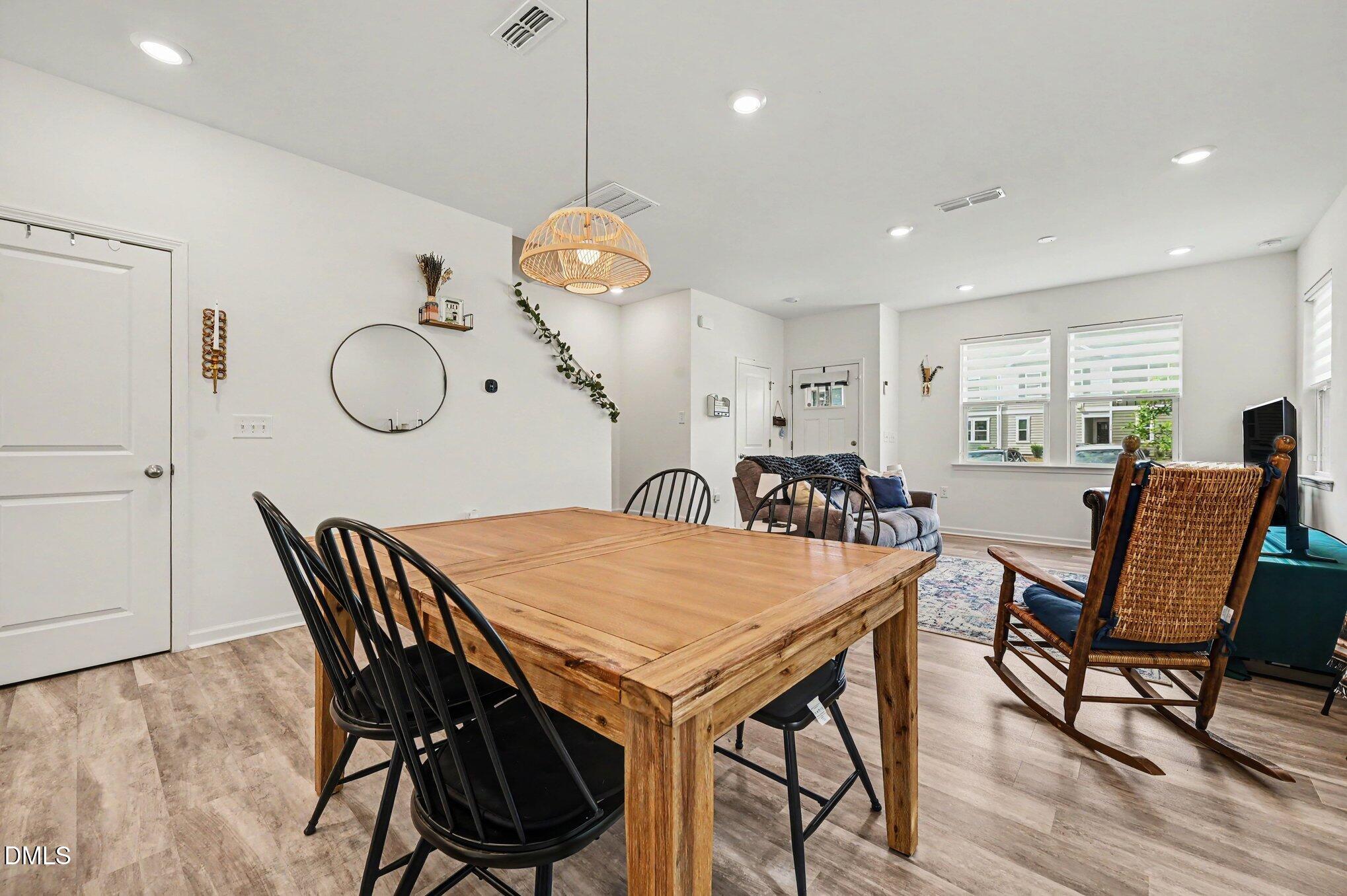574 Hacksaw Trail Raleigh, NC 27610 - Photo 6 of 28 a view of a dining room with furniture window and wooden floor