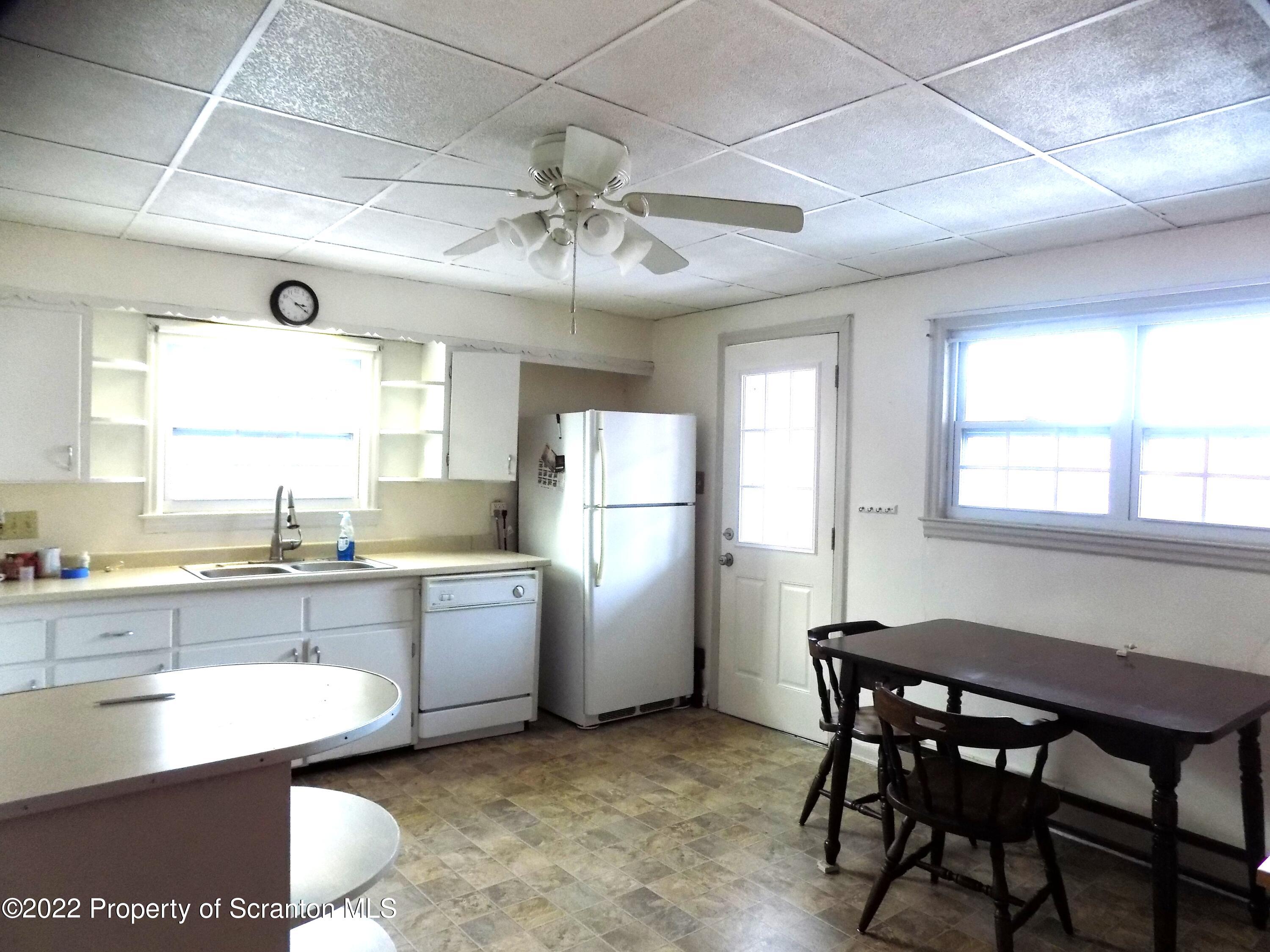 624 Court Street Scranton, PA 18508 - Photo 3 of 13 a kitchen with sink cabinets and window
