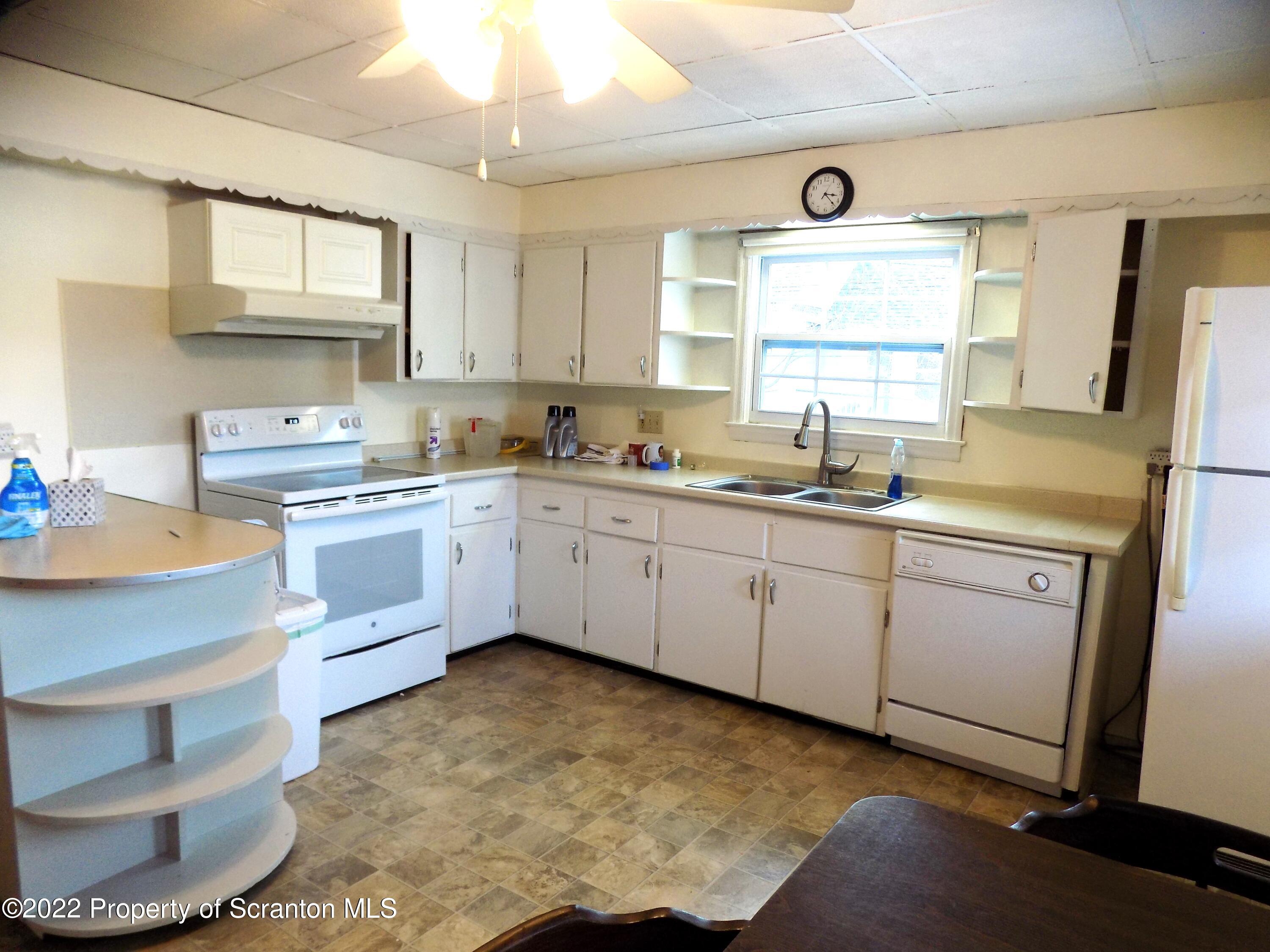 624 Court Street Scranton, PA 18508 - Photo 5 of 13 a kitchen with cabinets a sink and appliances