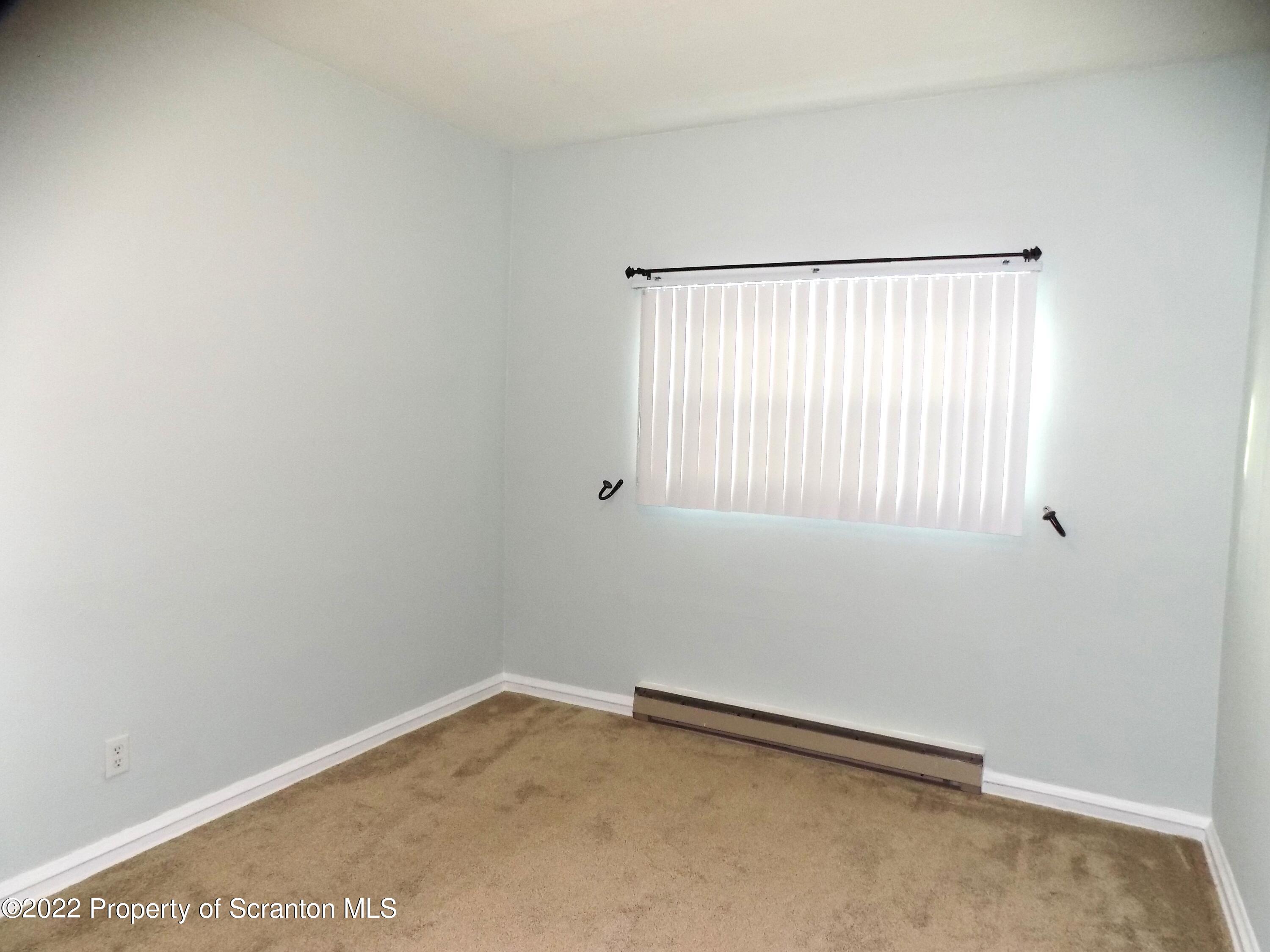 624 Court Street Scranton, PA 18508 - Photo 9 of 13 a view of an empty room with a window
