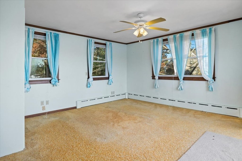 12 Nye Lane Bourne, MA 02532 - Photo 12 of 38 a view of a room with window and a ceiling fan