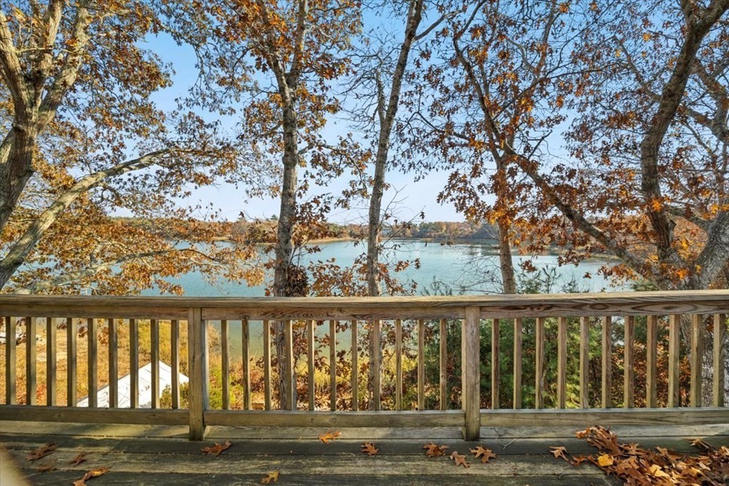 12 Nye Lane Bourne, MA 02532 - Photo 15 of 38 a balcony with wooden floor and fence