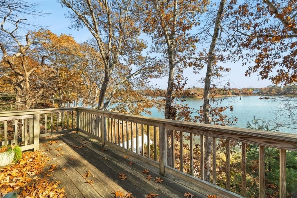 12 Nye Lane Bourne, MA 02532 - Photo 16 of 38 a view of a balcony with wooden floor and fence